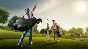 Three people carrying golf clubs walk across a grassy golf course under a cloudy sky One person raises their arm in the air